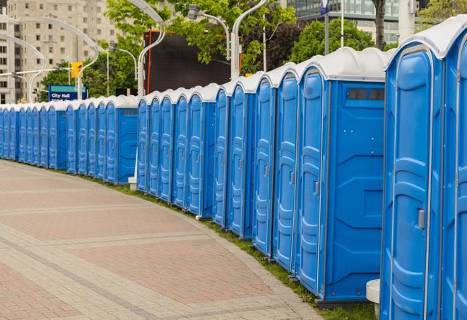 a row of portable restrooms set up for a large athletic event, allowing participants and spectators to easily take care of their needs in Belton